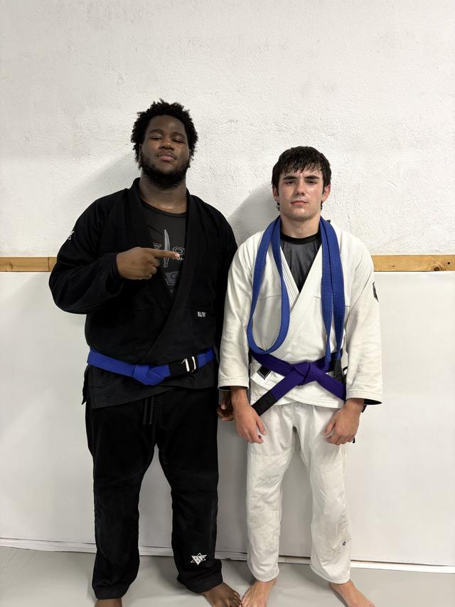 Gonçalo with a teammate on purple belt day