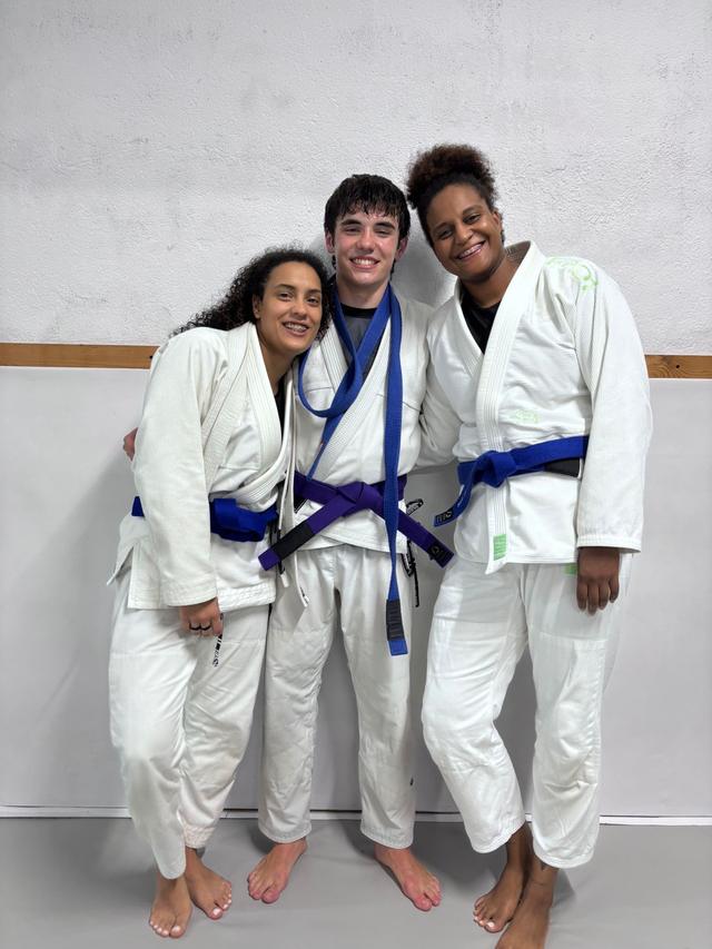 Gonçalo with two training partners on purple belt day