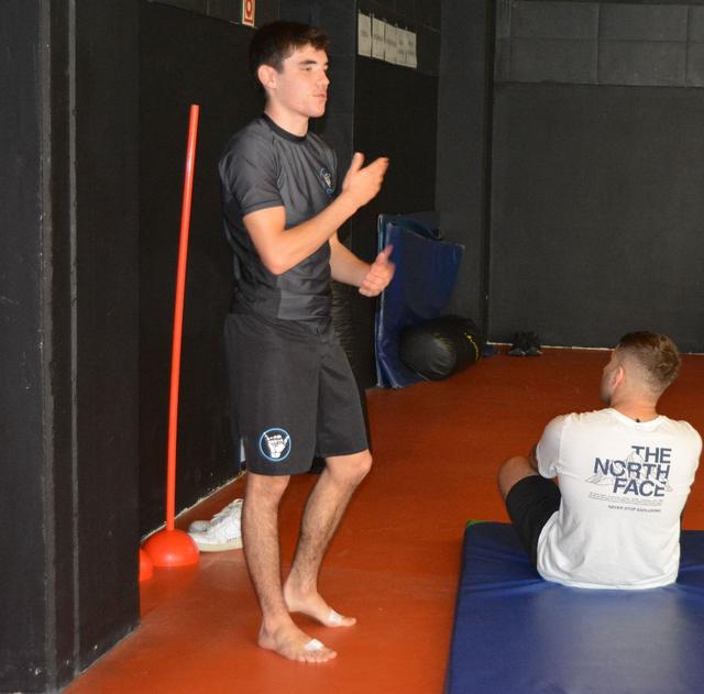 Gonçalo explaining a position on the mat